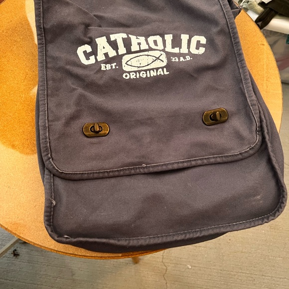 25% off listed price.Crossbody strap bag.Catholic emblem on front.Good condition - Picture 3 of 7
